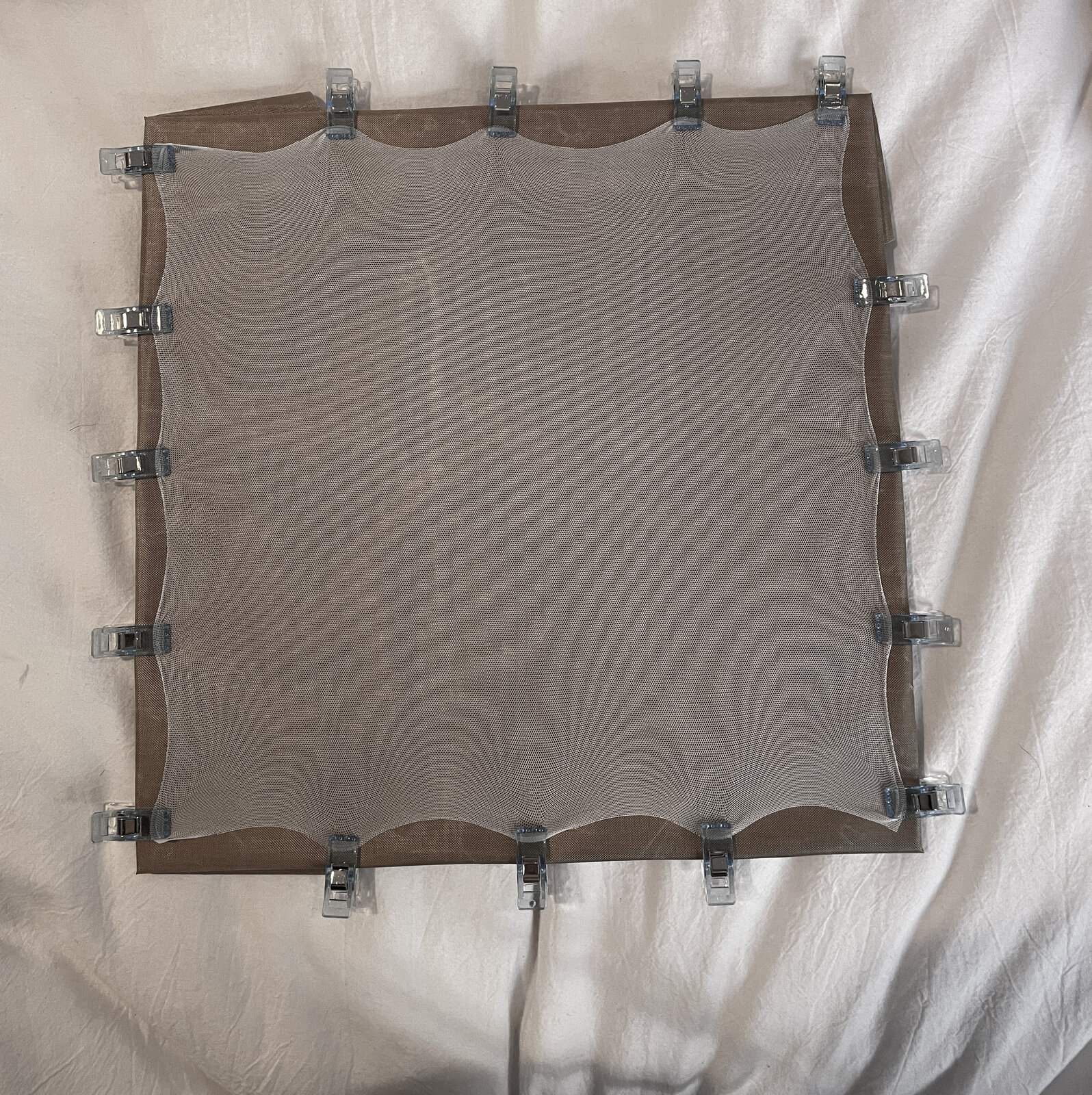 Stretched mesh fabric on frame